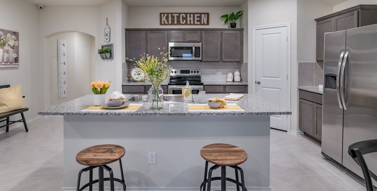 Large Island and Stainless Appliances in Kitchen at Wildcat Ranch Model Home for Sale