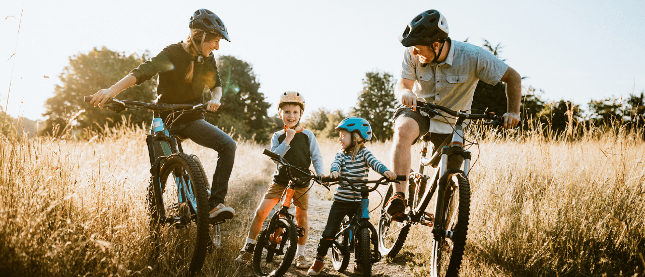 Family biking in a field