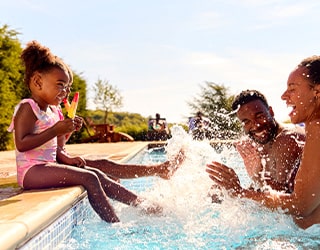 family in the wildcat pool having fun