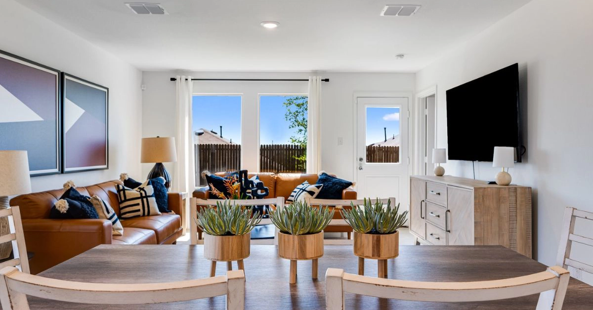 Open-concept living room and dining area inside a new home at Wildcat Ranch in Crandall Texas